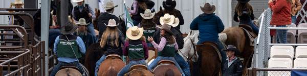 UVU's College Rodeo Team riding in the arena