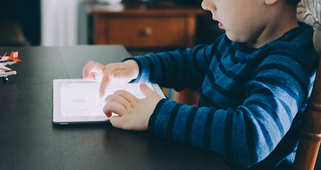 Child using a tablet device.