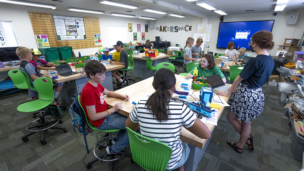Students engaging with interactive technology at UVU's Creative Learning Studio, a innovative space recognized for promoting equality and innovation in STEM education.