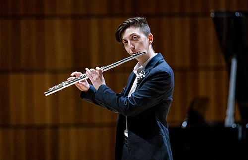 Flautist performs.