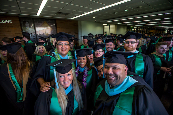 Many graduated students in caps and gowns