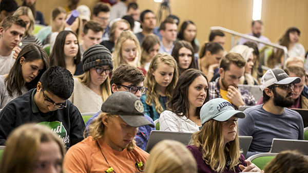 Students seated in lecture hall.