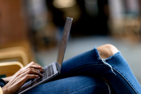 Image of a students laptop on their lap