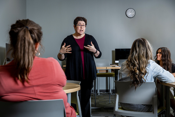 Image of a professor in front of a classroom