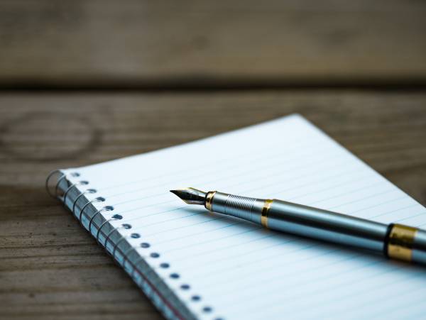 Image of a pen and paper