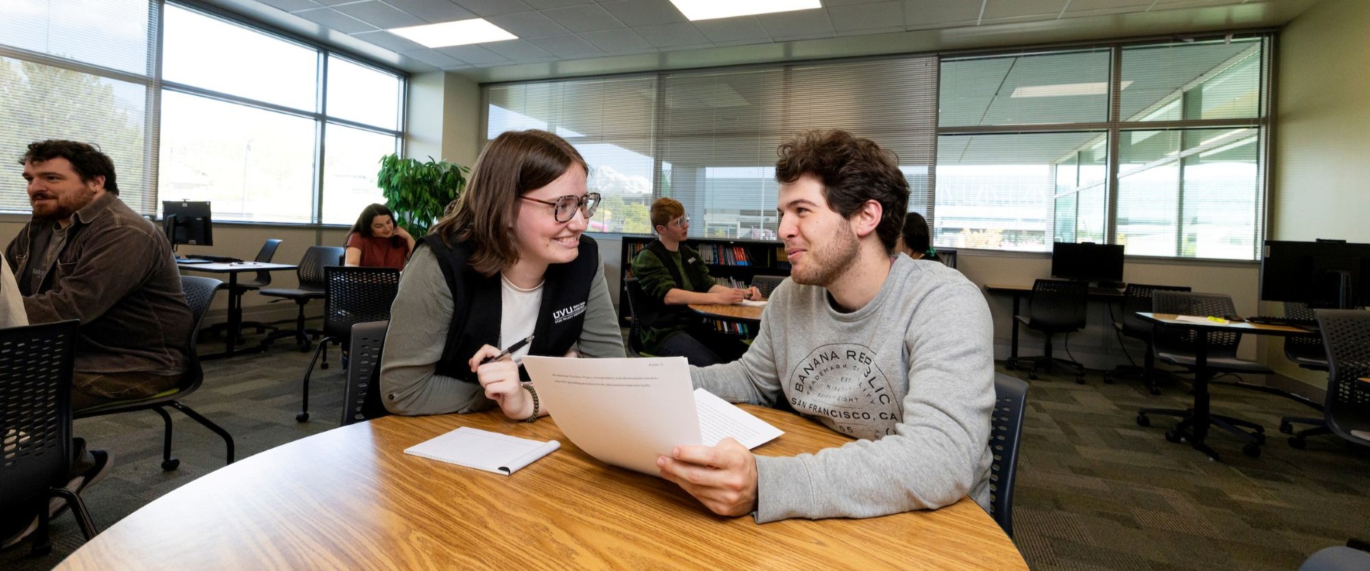 writing center tutor helping out a student in the Writing Center