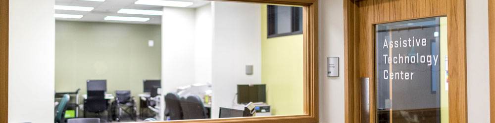 view of the interior of the assistive technology center through a window