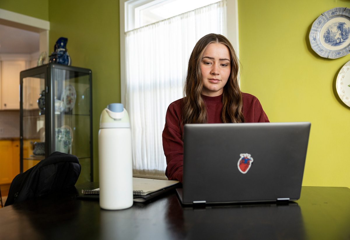  student on their laptop