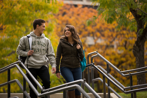 Two UVU students walking