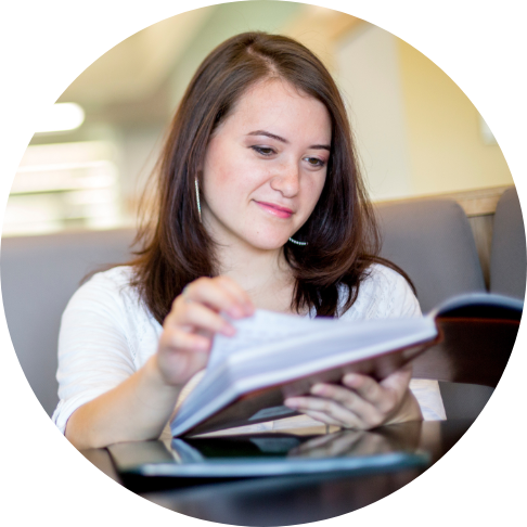 Female student reading a book