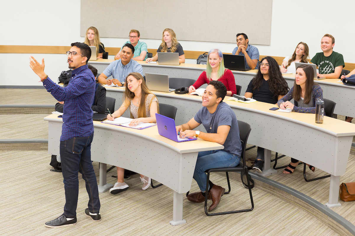 A professor teaching a classroom of students