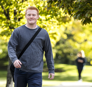 student walking outside