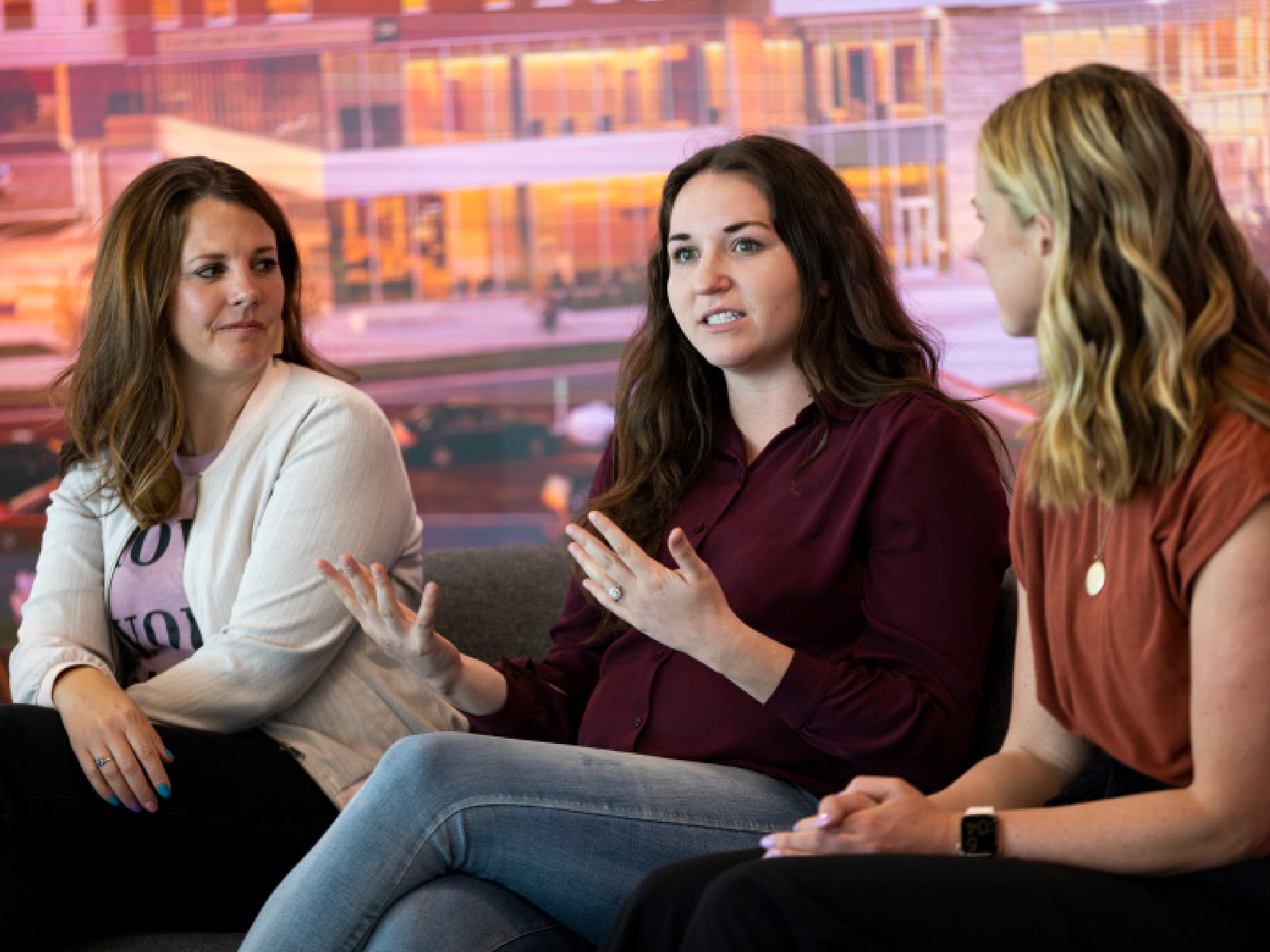 three female students talking together