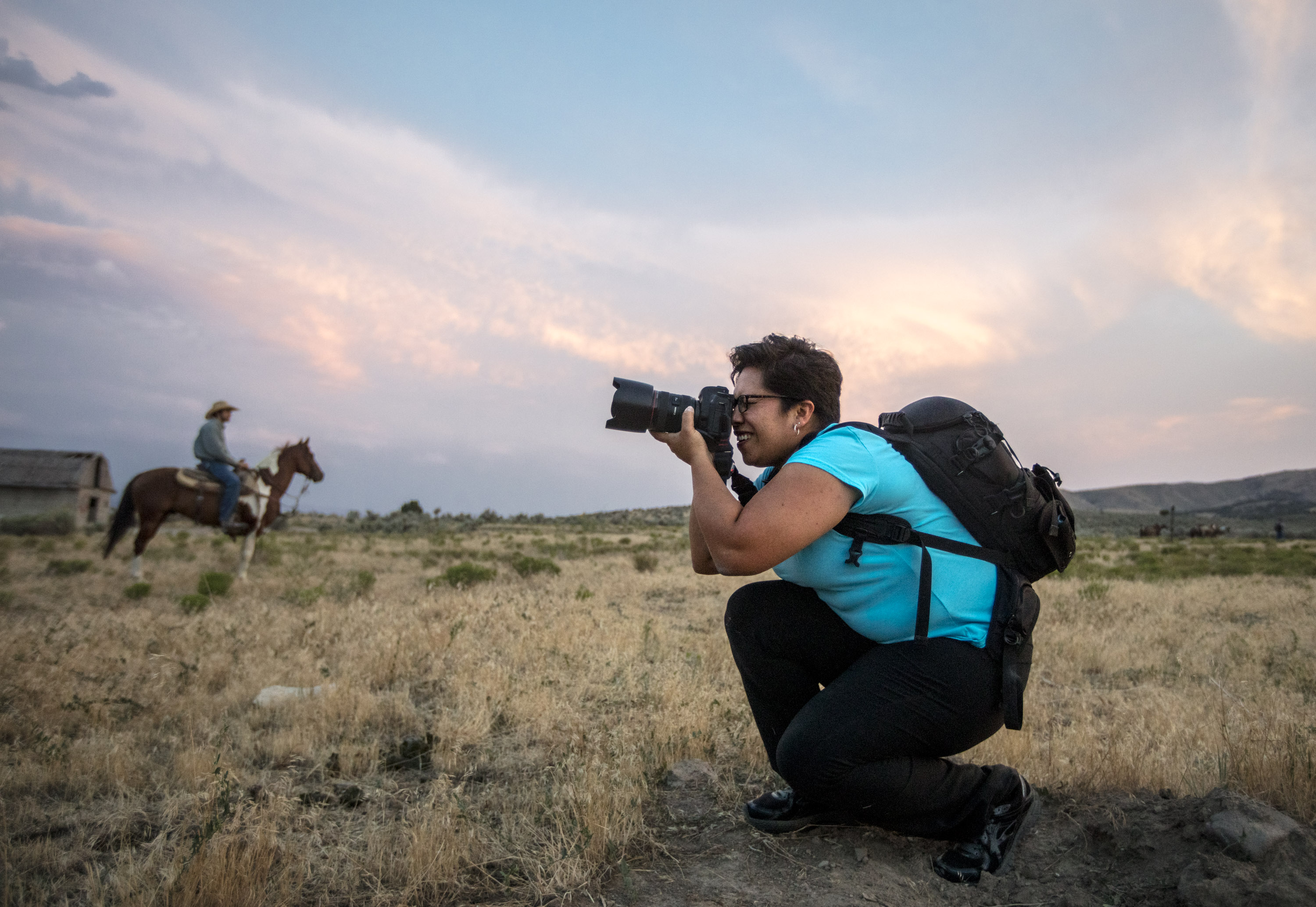 photographer taking picture of horseback riders