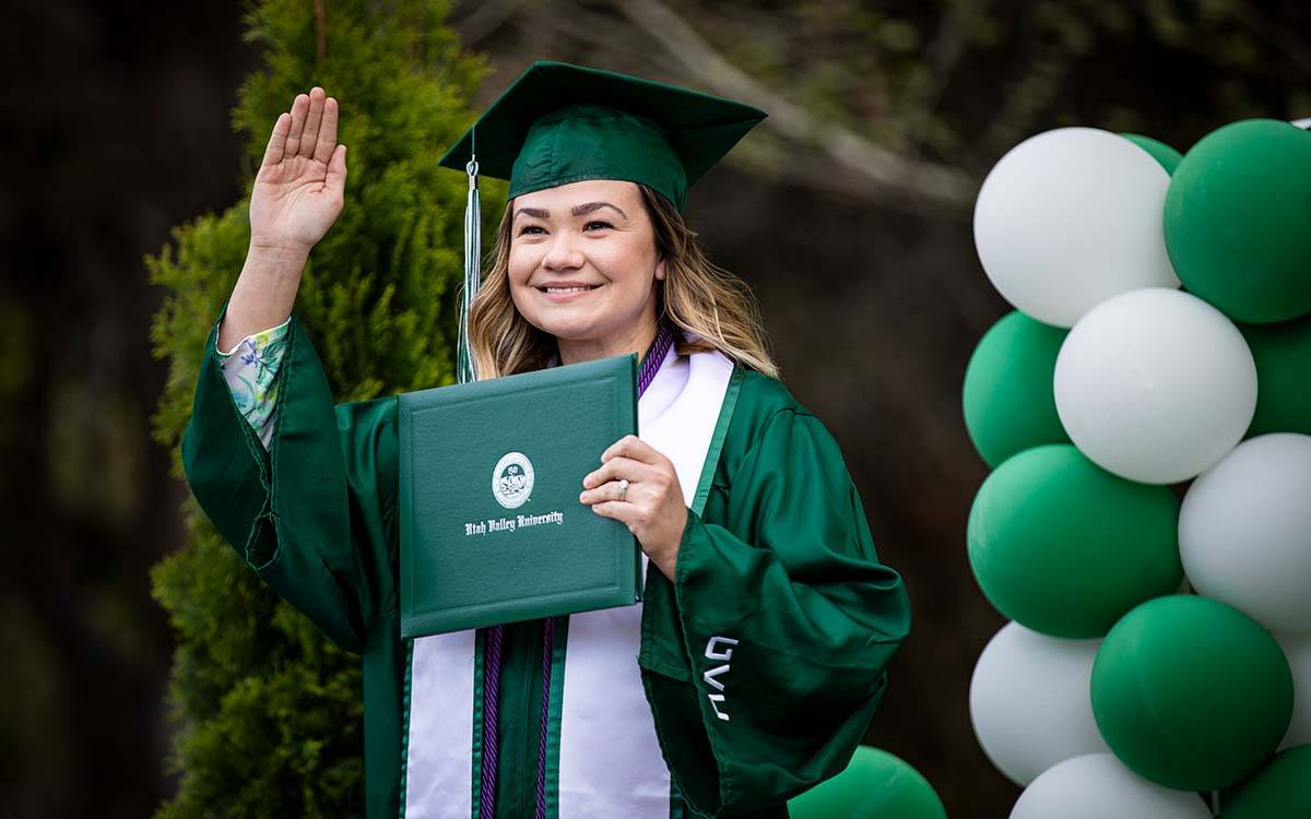 graduate posing for a photo