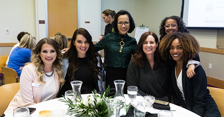 Several women smile for the camera at the DoTerra Luncheon
