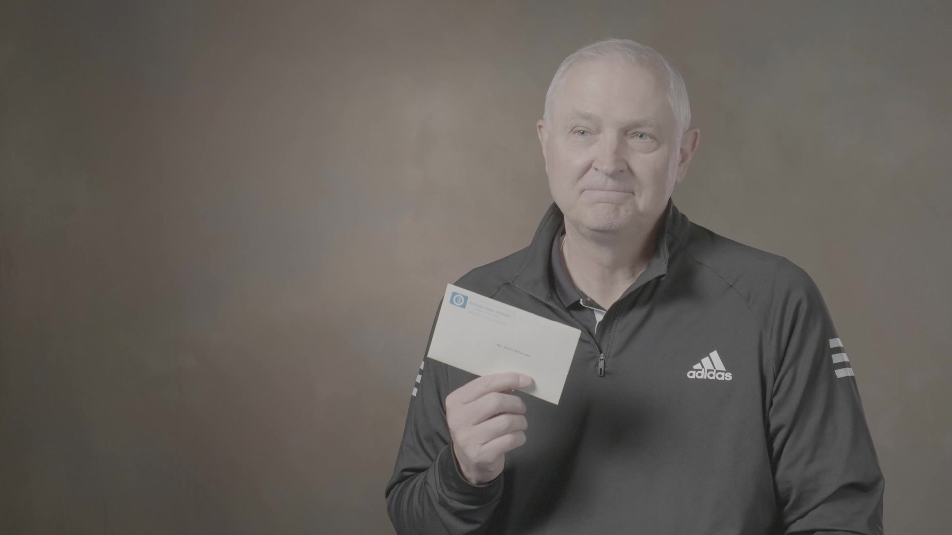 Kris McFarland holding the letter he received in 1978 from his teacher Lyle Meyer