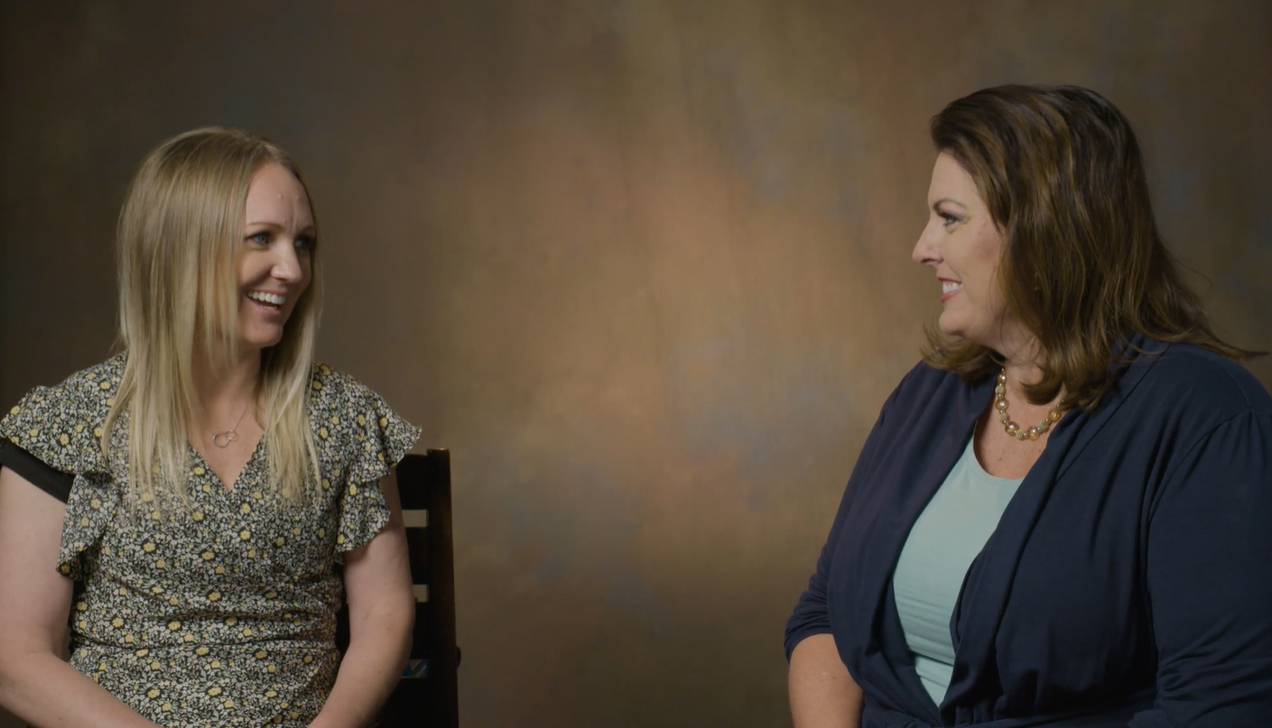 Susan West (left) speaking with Kristie Kapp, the daughter of Sherman and Sheryle Cloward.