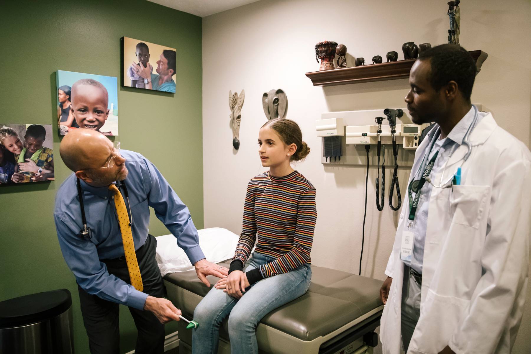 A UVU Physician Assistant Program student helping examine a patient.