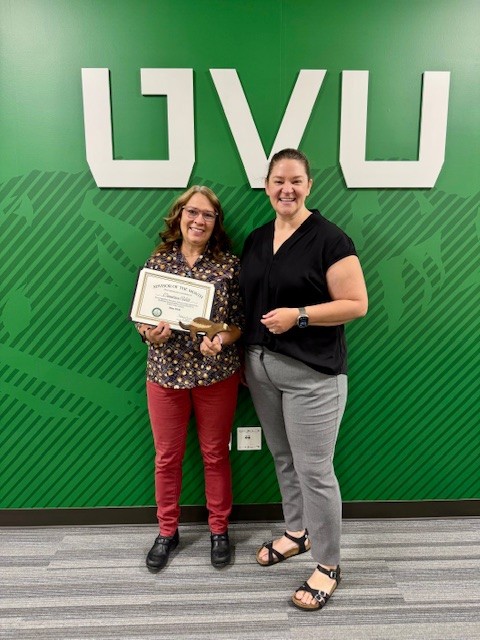 Candace Hill poses with award with Tara Ivie