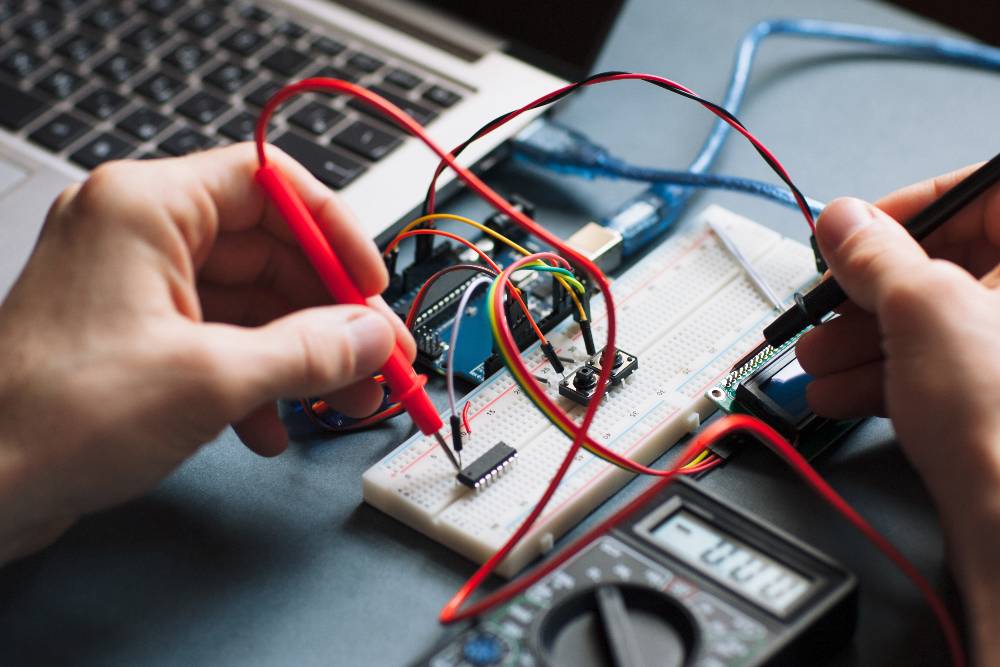 person using meter to test voltage