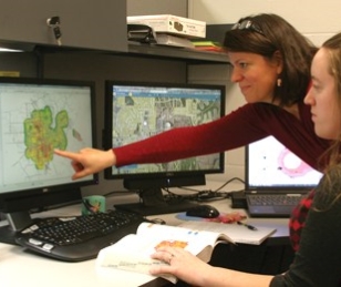 two people looking at a computer