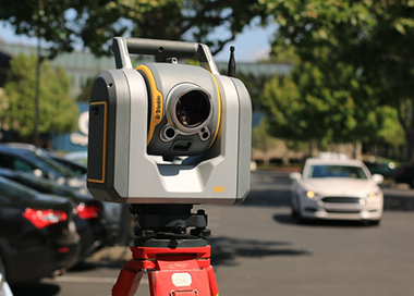 Surveyors tools on a busy street