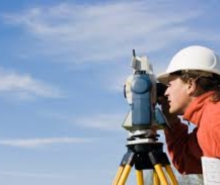 person using surveying device