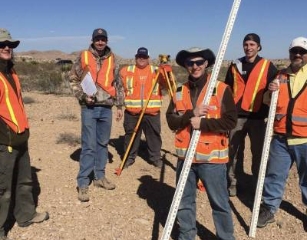 UVU surveying students holding surveying equipment 