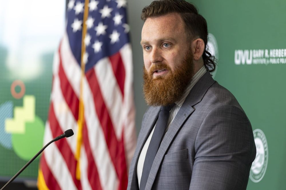 Brandon Amacher, Director of UVU's Emerging Tech Policy Lab (EMTECH), addresses the audience at the Gary R. Herbert Institute for Public Policy event