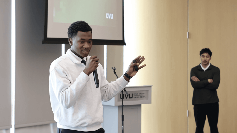 Mohamed Maiga and Ivan Diaz (right) present to internal auditors from the Utah System of Higher Education at Utah Valley University.