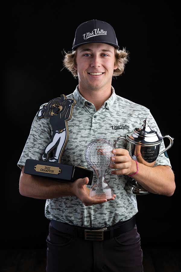 UVU golfer Brady McKinlay poses with three trophies he’s won. 