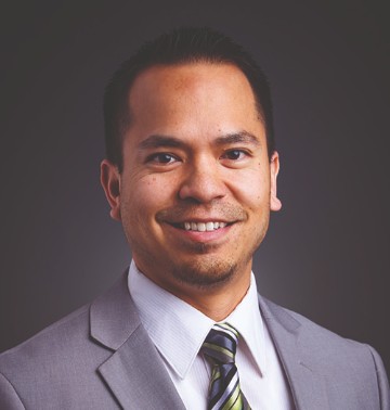 Headshot of Kyle Reyes, vice president of Institutional Advancement. 