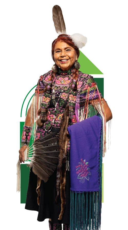 Native American beadwork instructor Judy Mansfield, wearing traditional Native American beadwork clothing, smiles and poses with a purple beaded cloth. Native American beadwork instructor Judy Mansfield, wearing traditional Native American beadwork clothing, smiles and poses with a purple beaded cloth.