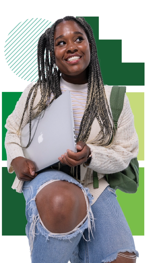 A student with long braids and a cream cardigan holds a laptop and smiles. A student with long braids and a cream cardigan holds a laptop and smiles.