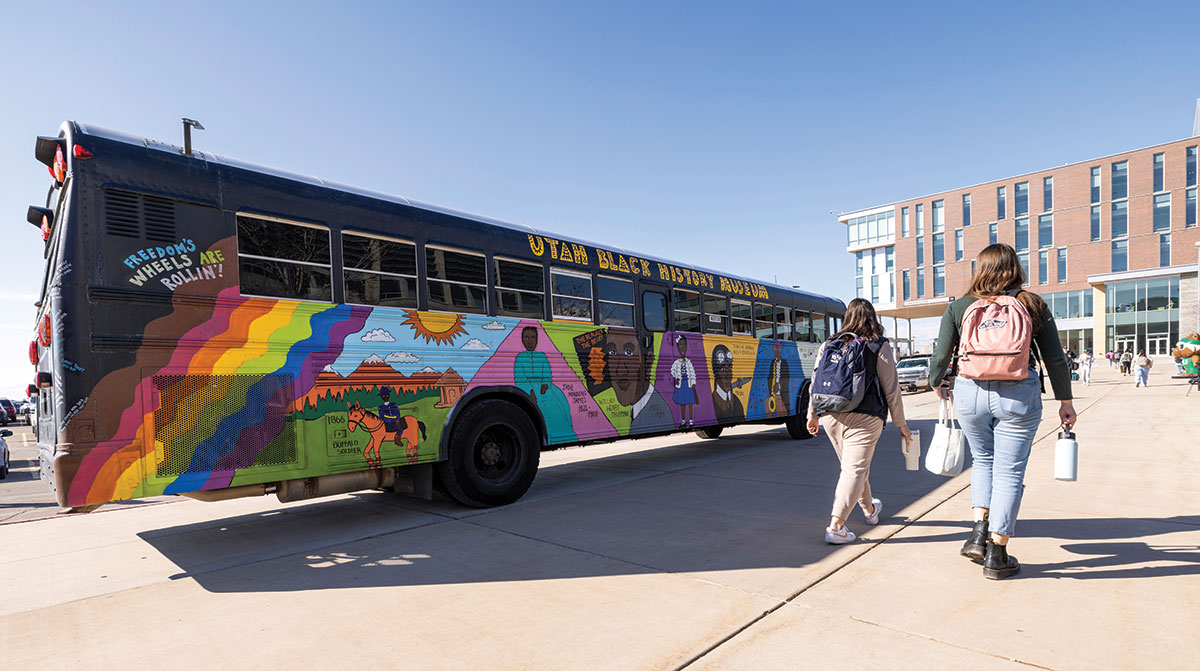 Students walk by the Utah Black History Museum bus, which visited UVU’s Orem Campus in February 2023.