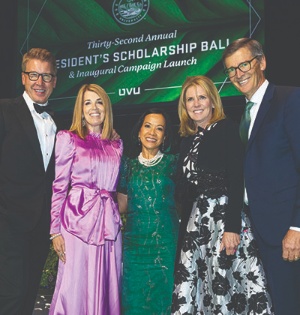 A group of President’s Scholarship Ball attendees poses with UVU President Astrid S. Tuminez. 
