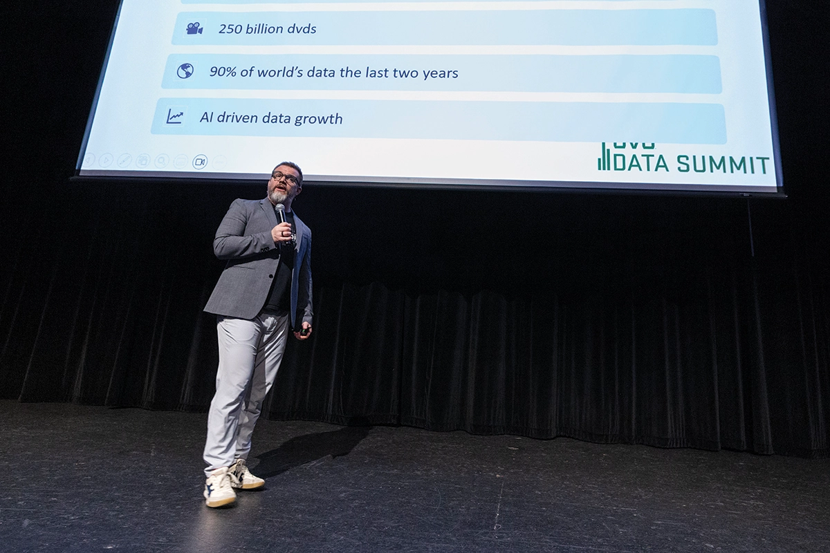 Wearing a gray suit jacket and glasses, Jordan Morrow, senior vice president of data and AI transformation at AgileOne speaks on stage at the 2025 Data Summit. Wearing a gray suit jacket and glasses, Jordan Morrow, senior vice president of data and AI transformation at AgileOne speaks on stage at the 2025 Data Summit.