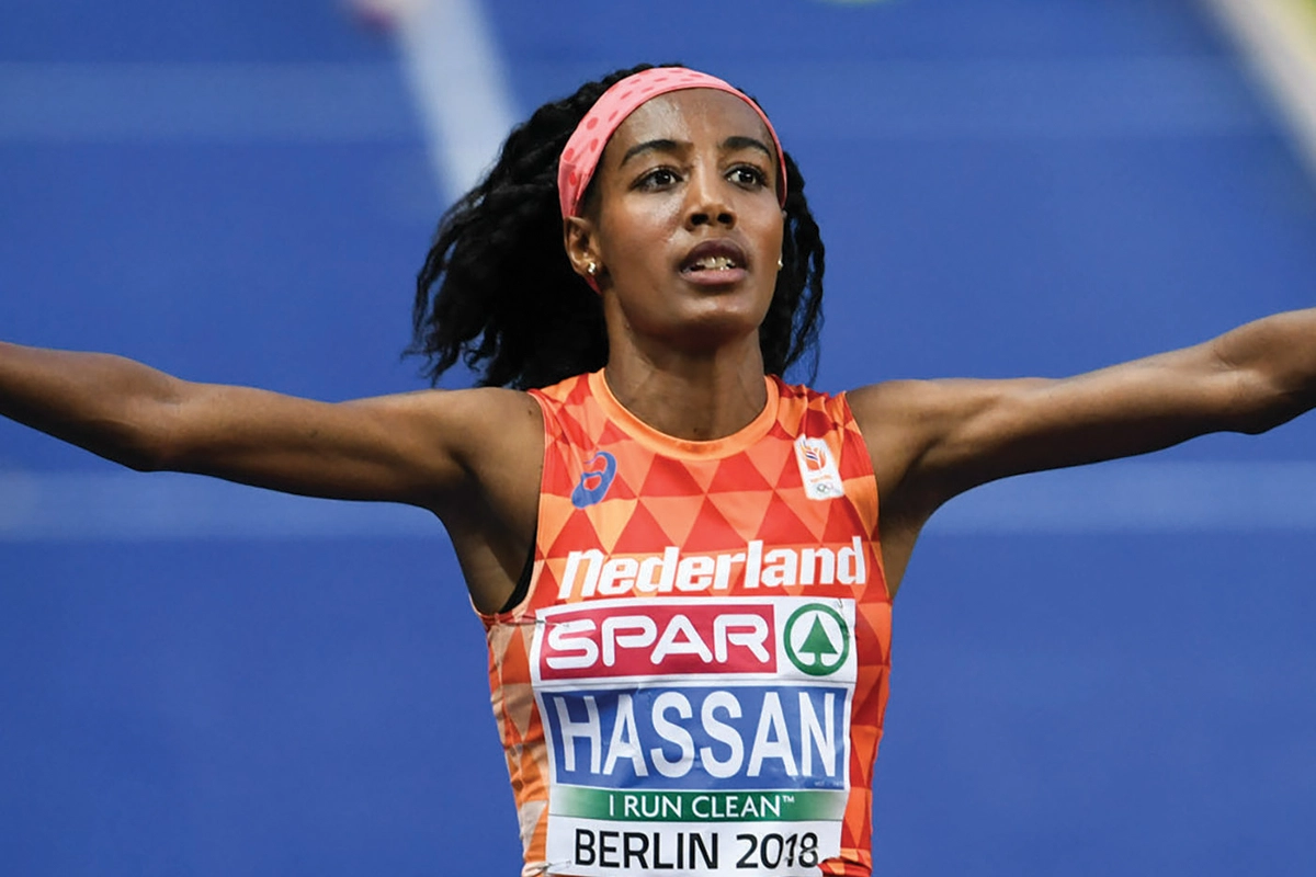 Photo of Dutch Olympic runner Sifan Hassan, wearing a red tank top. Photo of Dutch Olympic runner Sifan Hassan, wearing a red tank top.