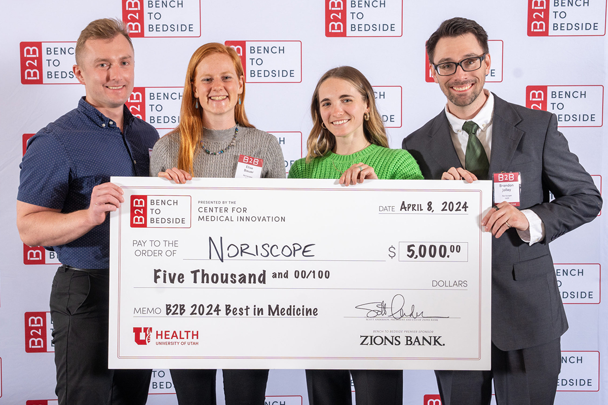 Students from UVU’s College of Science, who competed in the 'Bench to Bedside' competition at the Utah State Capitol, smile while posing with a giant check for $5,000, which they won in the competition