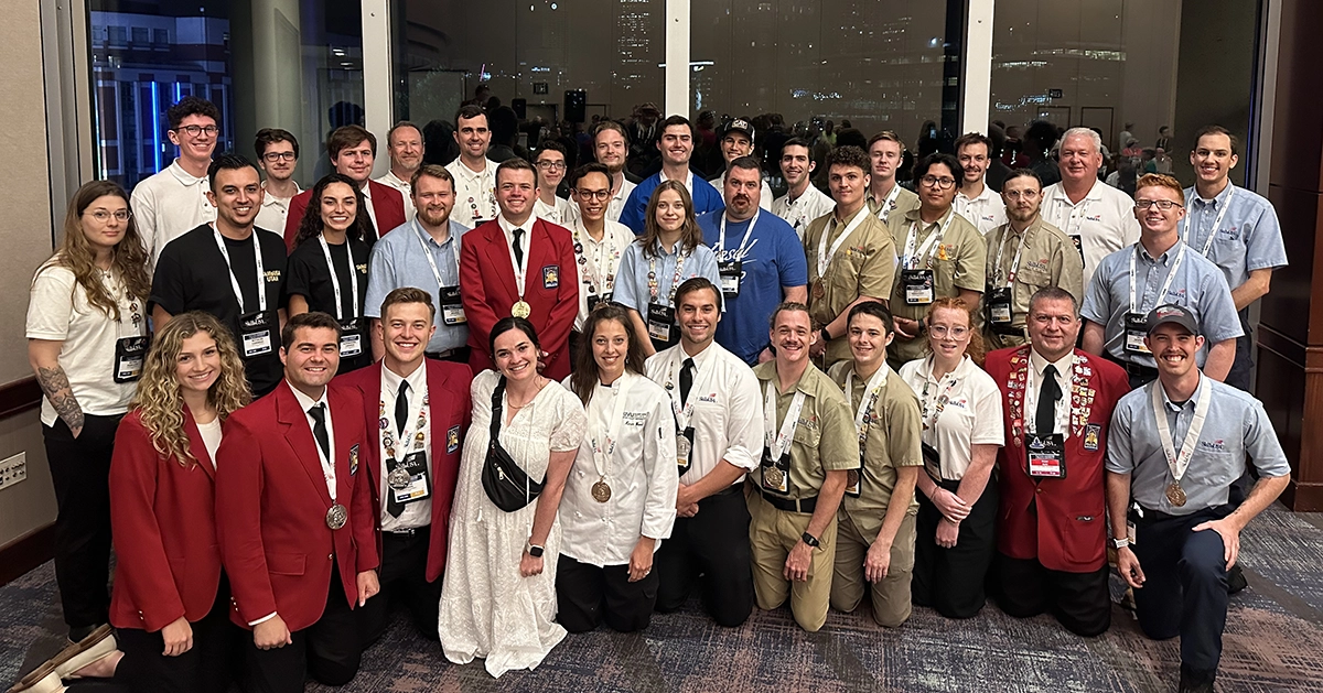 A group of UVU students participating in SkillsUSA pose for a photo during the national competitions in Atlanta, Georgia. 