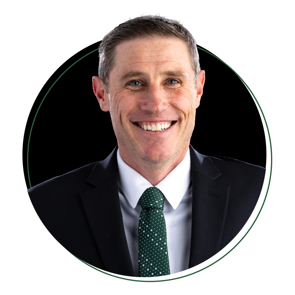 Headshot of Todd Okeson, associate head coach of UVU men’s basketball. 
