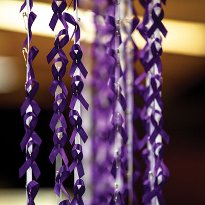 Close-up of many purple ribbons, symbolizing the fight against domestic violence. 
