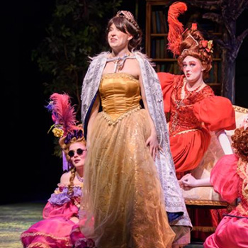 Photo of actors on stage in costume for 'Into the Woods'.