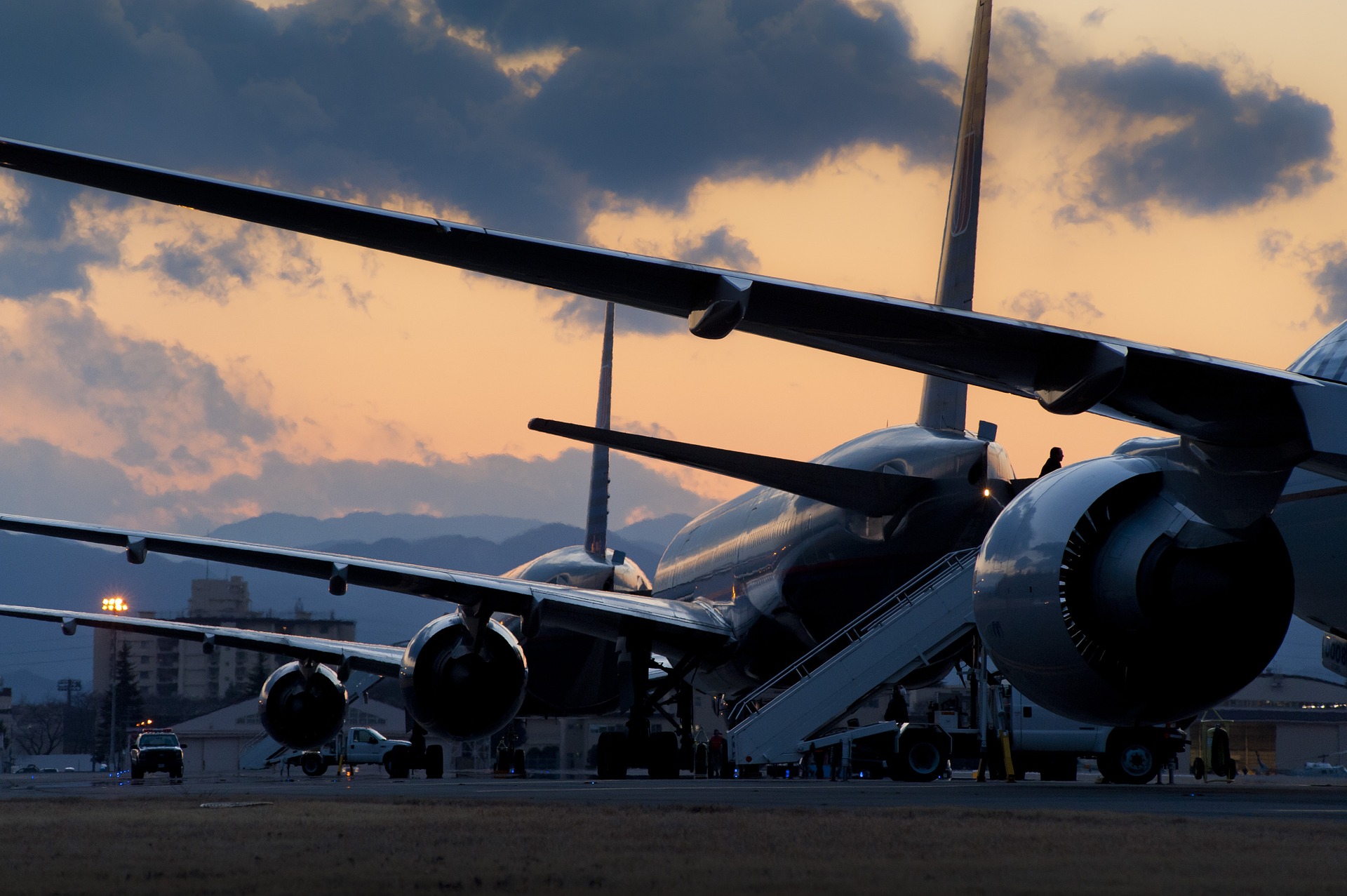 Commercial Airplanes lined up at an airport