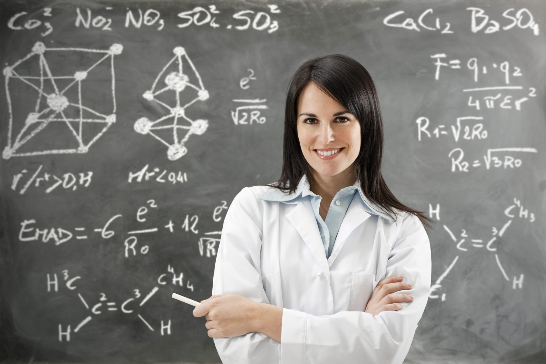 Chemistry Teacher in front of Chalkboard