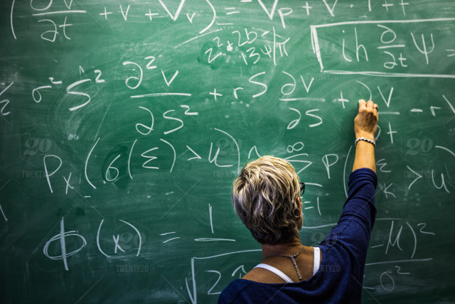 Woman writing on chalkboard