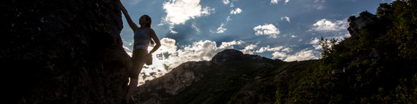 UVU student rock climbing with competitive sports