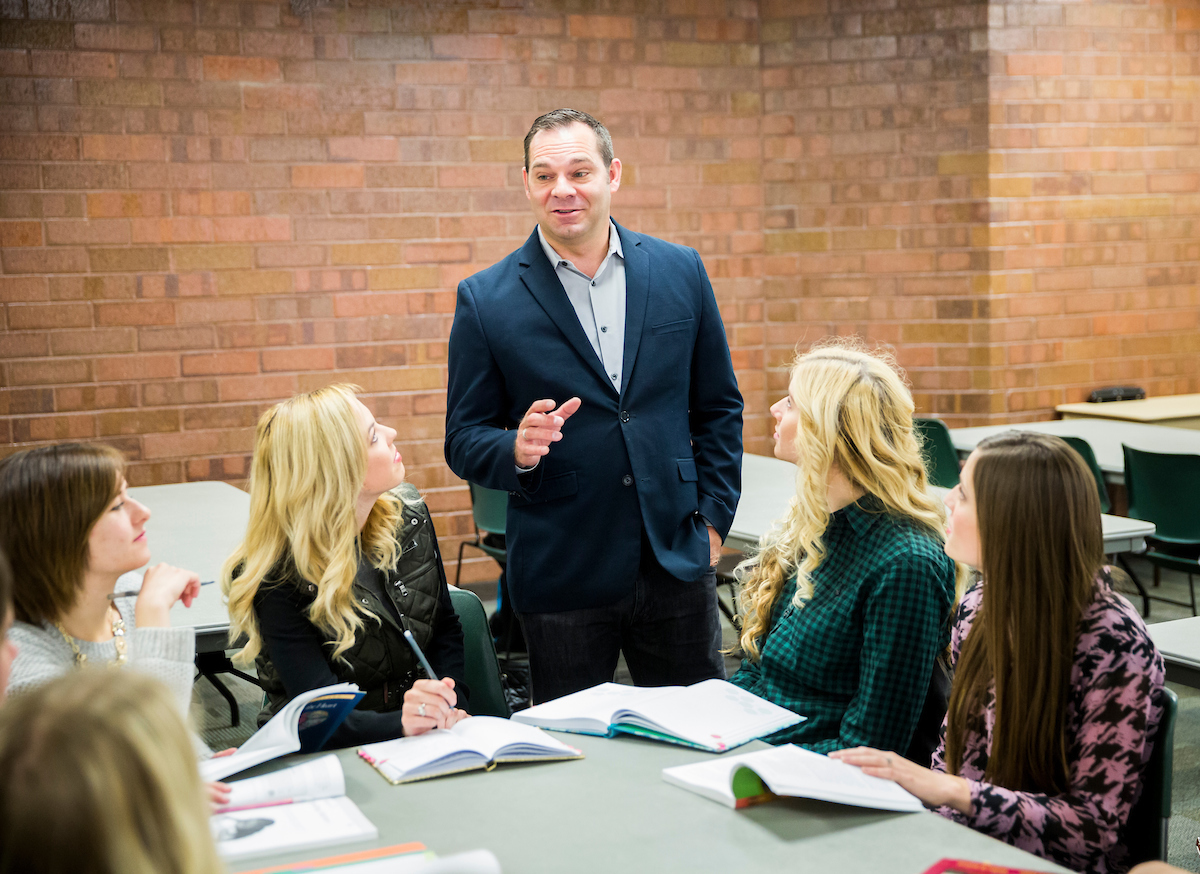 Teacher talking to students