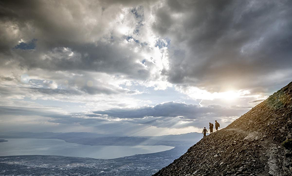 people walkin on a mountain side